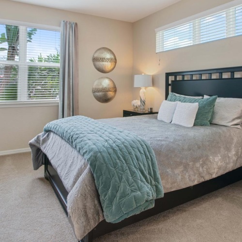 a bedroom with a bed and a dresser