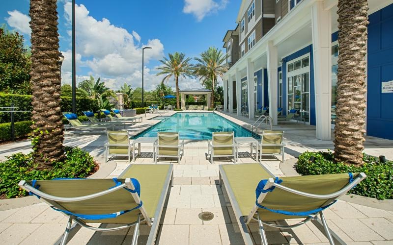 a pool with chairs around it
