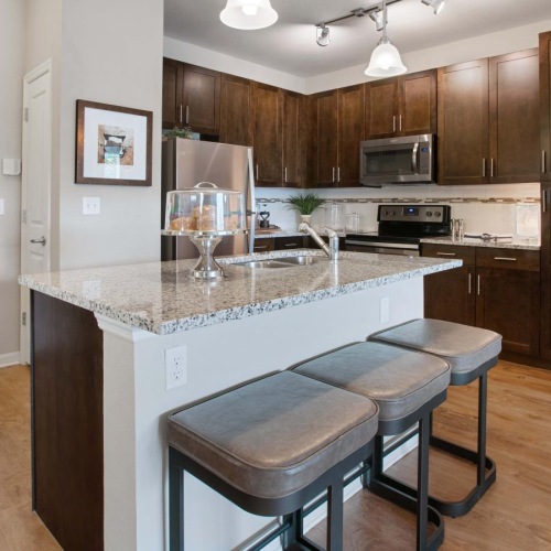 a kitchen with a marble island