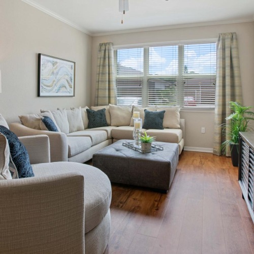 a living room with a couch and a tv