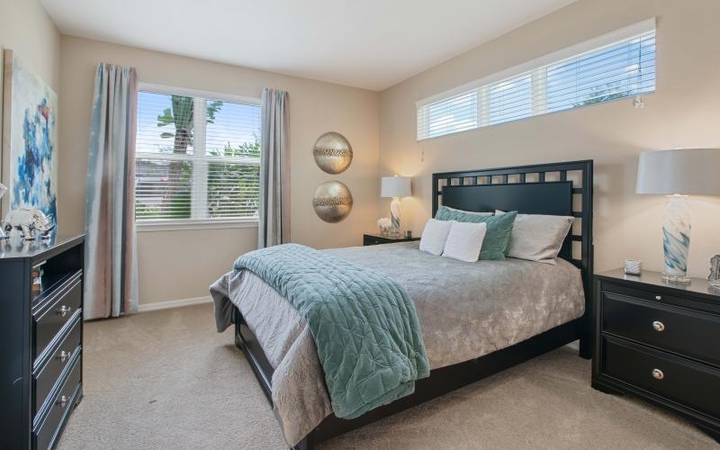 a bedroom with a bed and a dresser